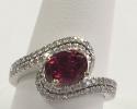 This is a stunning 14kt white gold diamond ring featuring a pink tourmaline. 