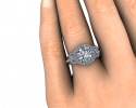 This beautiful ring sits perfectly on its bride's finger.  A tri-stone display with halos around each. 