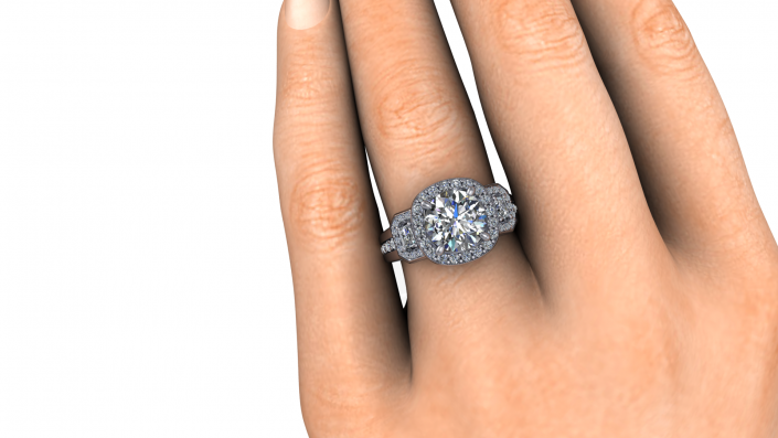 This beautiful ring sits perfectly on its bride's finger.  A tri-stone display with halos around each. 