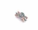 This beautiful ring features a unique design with both rose gold and white gold.  As three bands come together in a nebula of twinkling diamonds, a .8 karat round diamond shines brightly as the center stone among the rest. 