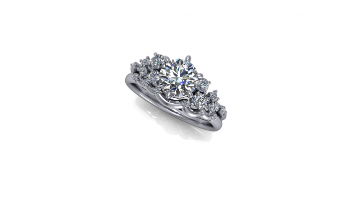 This is a beautiful sterling silver ring that displays an array of twinkling diamonds. As the complementing stones build on one another they create a highlight for the beautiful center stone.
