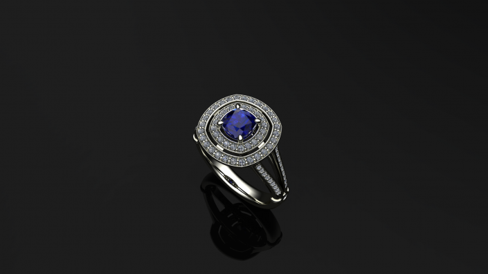 This beautiful sapphire ring creates the perfect engagement piece.  Encompassed in a sparkling double halo of diamonds sits a cushion-shaped sapphire.  Allow us to create you a unique piece such as this one at J Olivers. 